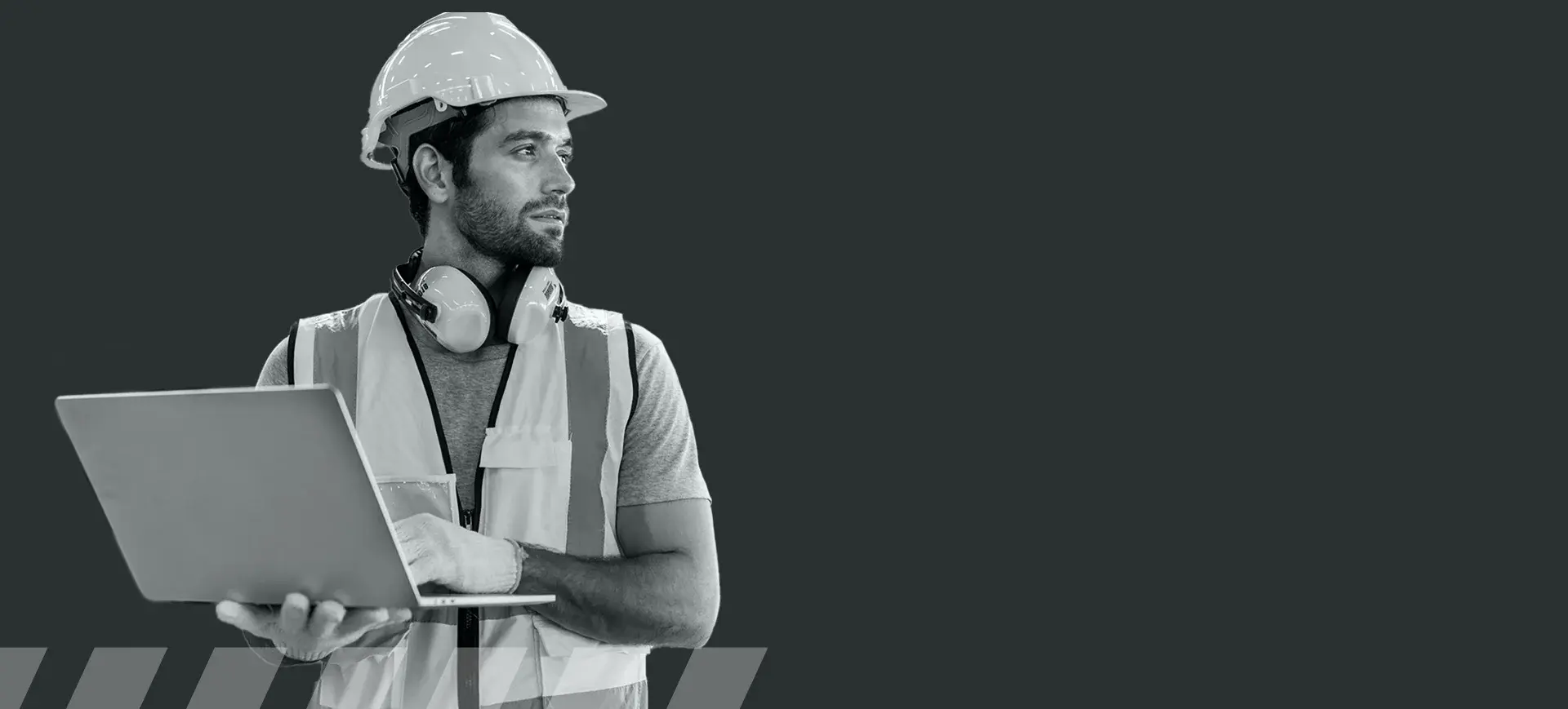 Construction worker reviewing plans on a tablet