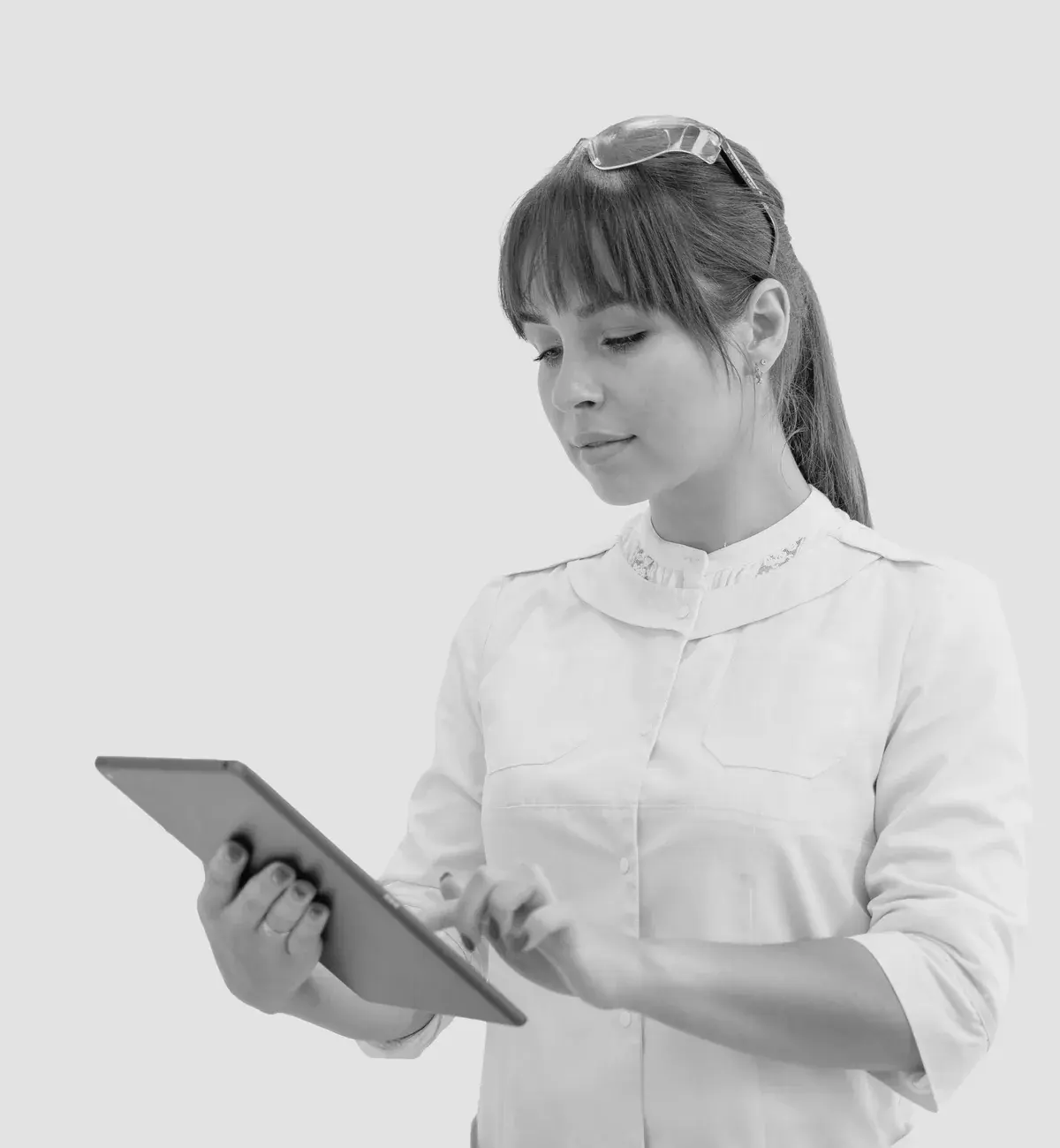 Med spa professional managing bookings on a tablet